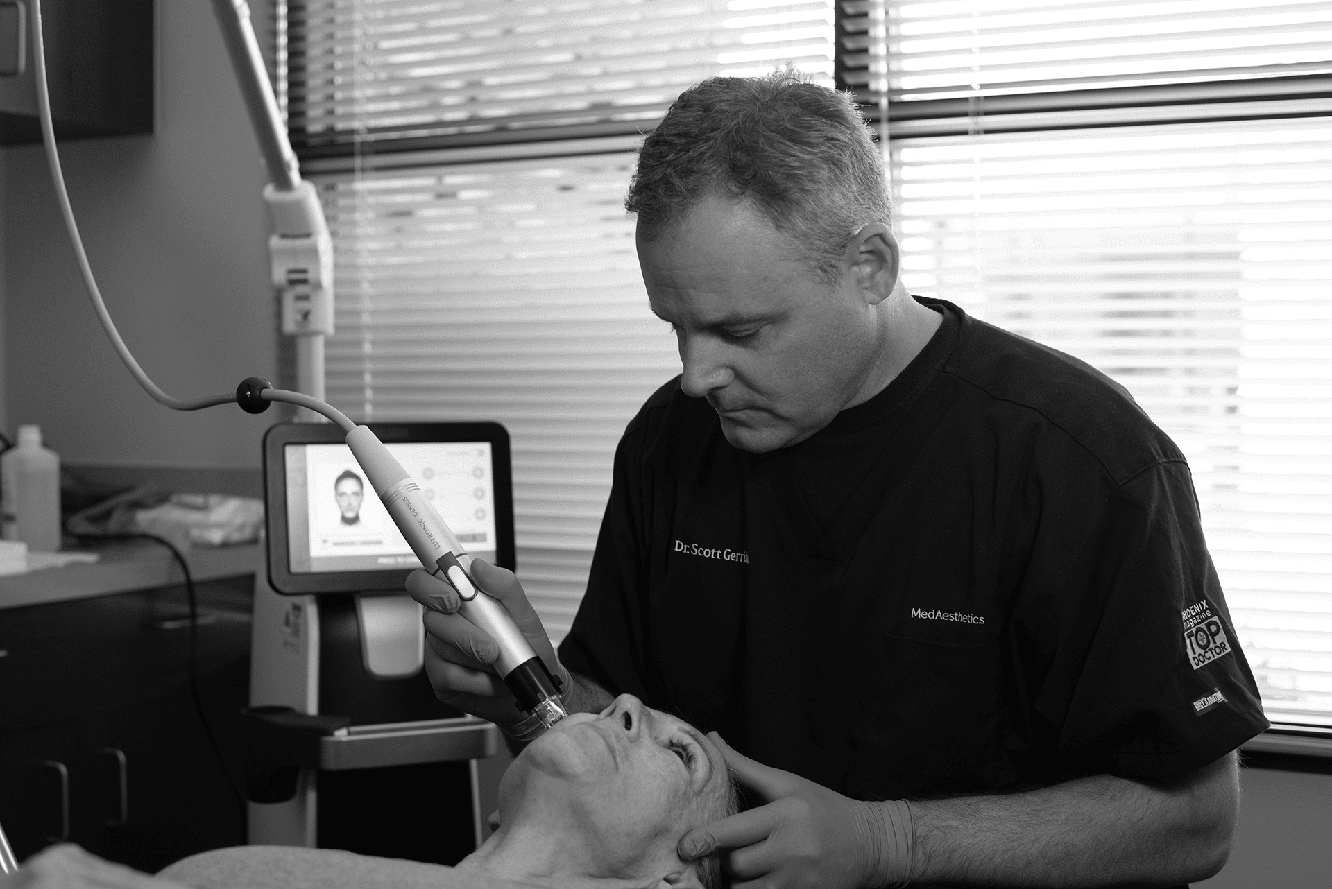 Dr Scott Gerrish doing Silent Lift Treatment on patient